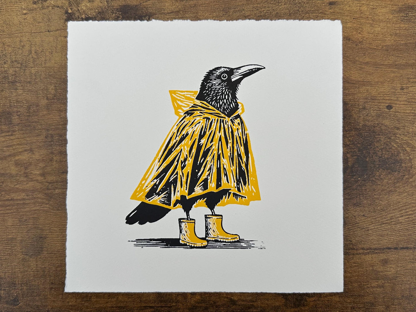 Mac & Wellies - Original Handmade Linocut Print of a Crow in a Yellow Raincoat and Wellington Boots.
