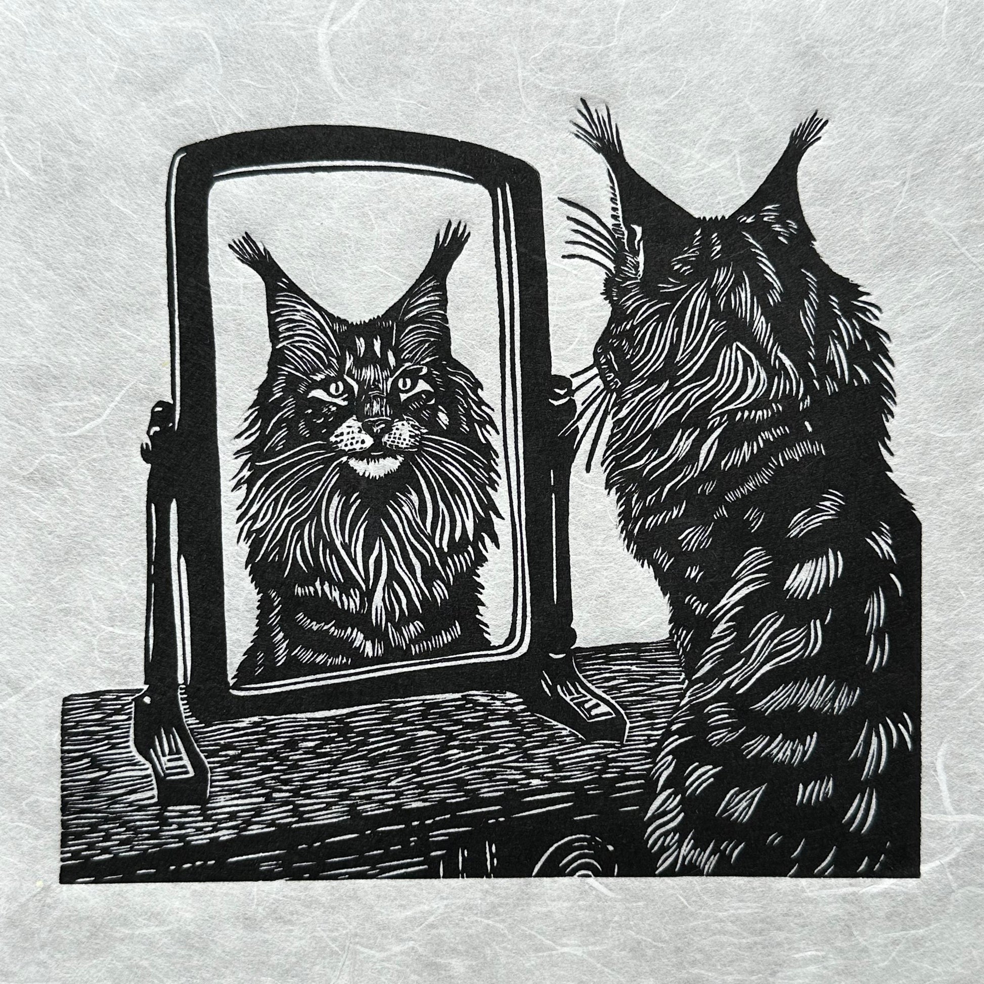 A black and white image of a cat, a maine coon looking at its reflection in a mirror, a perfect gift for cat lovers, wonderful linocut print. 
