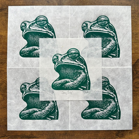 A green frog with its arms crossed and a sassy expression on its face. A perfect representation of moodiness; whether bossy, judgy, or just sassy.